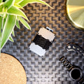 Picture of a Nighthawk RFID Card Holder with cash band laid out on a table