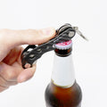 Picture of The Minimalist Key Organiser opening a beer