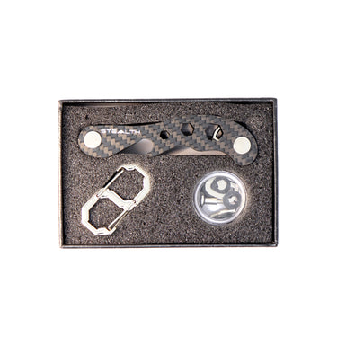 Picture of the Pocket Key Holder inside a gift box showing the item and spare parts