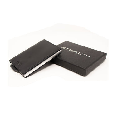 Picture of the Raptor RFID Enhanced Bifold Wallet  next to a stealth wallets gift box